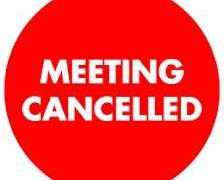 red round sign that says in white capital letters, meeting cancelled.