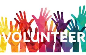 graphic of rainbow of raised hands with volunteer